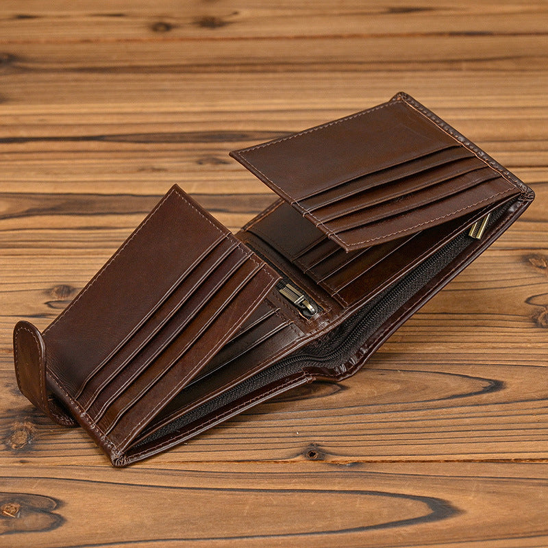 Open coffee leather bi-fold wallet showing multiple card slots and zipper storage